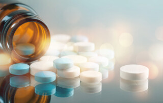 Colorful pills and tablets on background